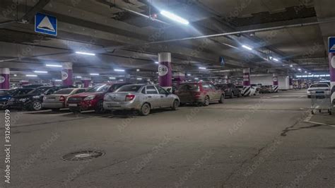 Motion of cars at entrance and exit in underground shopping mall parking time lapse Stock-video ...