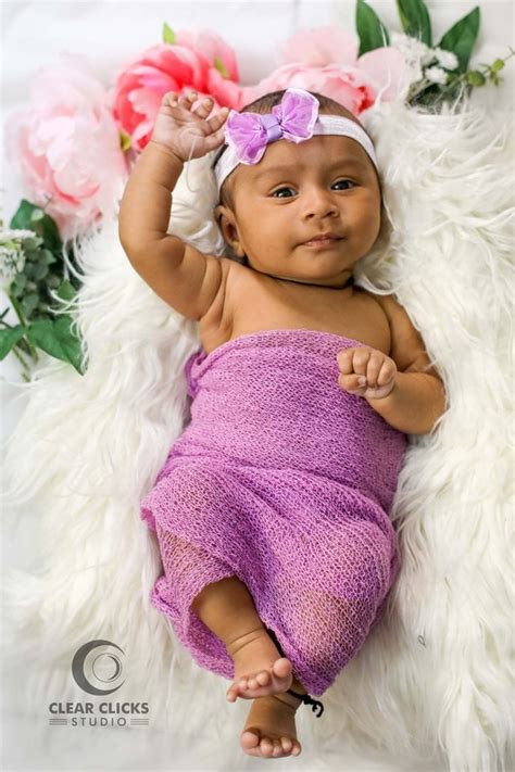 Two month old baby girl photoshootat home with props