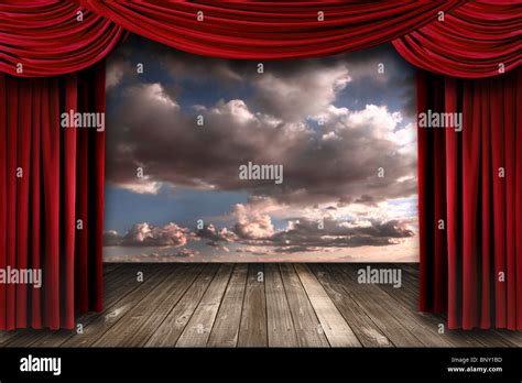 Beautiful Stage With Red Velvet Theater Curtains and Dramatic Sky Stock Photo: 30711953 - Alamy