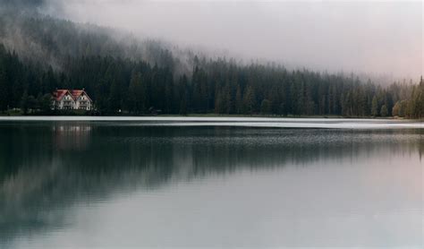 White and Red House Under Fog · Free Stock Photo