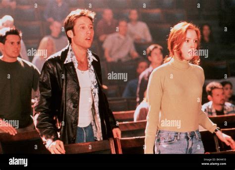 URBAN LEGEND (1998) MICHAEL ROSENBAUM, ALICIA WITT URBN 026 Stock Photo - Alamy