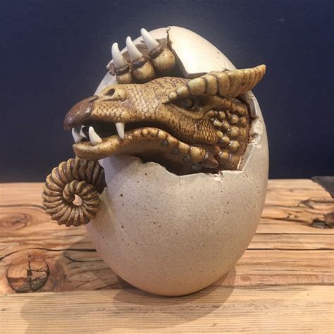 Peeper II by Dennis Thompson is a hand-built clay dragon egg.