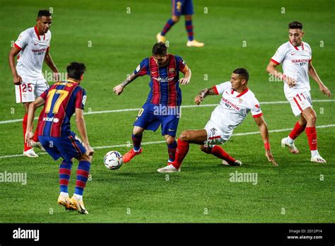 Lionel Messi of FC Barcelona and Diego Carlos of Sevilla FC during the ...