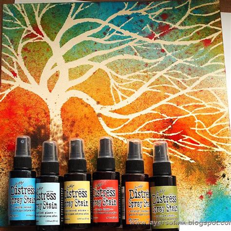 Using a tree stencil, spray ink colors over top - love this color ...