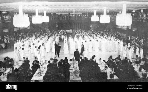 Debutantes dressed in traditional white line up during Queen Charlotte ...