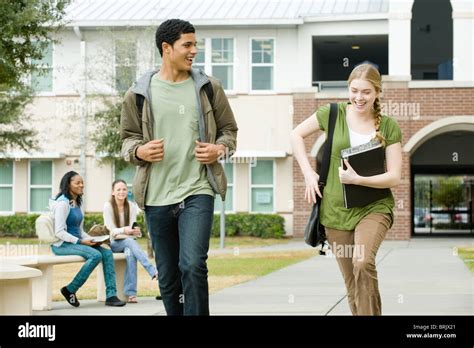 High school friends walking together on campus Stock Photo - Alamy