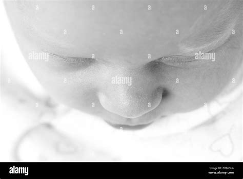 Cute sleeping newborn baby face Stock Photo - Alamy