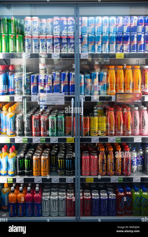 Fizzy drinks on sale in a supermarket fridge chiller Stock Photo - Alamy