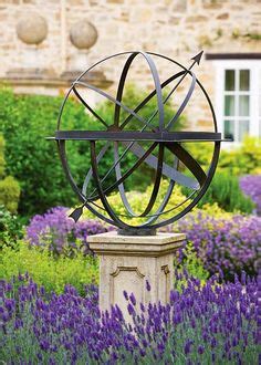 Brass armillary sundial amidst the lavender Garden Spheres, Garden ...