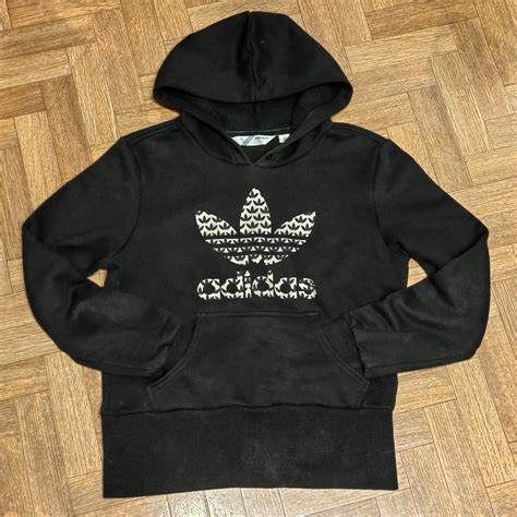 Adidas black and gold logo print hoodie. Size 10... - Depop