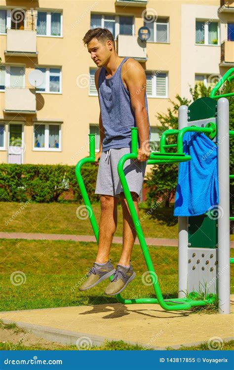 Man Doing Sit Ups in Outdoor Gym Stock Image - Image of weight, working: 143817855