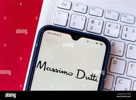 In this photo illustration of the Massimo Dutti logo seen displayed on a smartphone Stock Photo ...