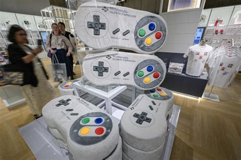 Cards to consoles: Nintendo launches first museum with interactive gaming and vintage exhibits ...