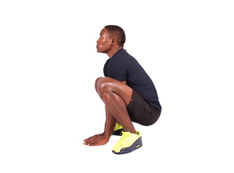 Fitness man doing deep squat exercise