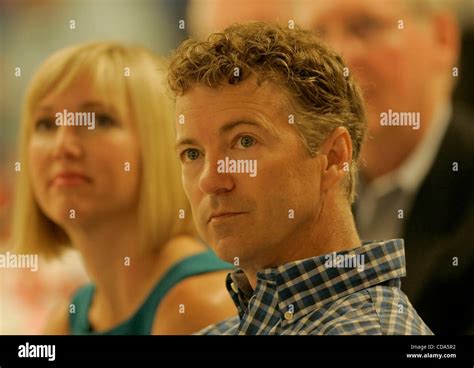 Tea Party Republican Senate nominee RAND PAUL (right) and wife KELLEY PAUL listen to a speech ...