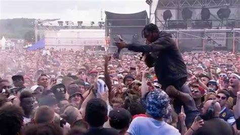 Travis Scott Crowdsurfs Then Attacks And Spits On A Fan For Allegedly Trying To Get His $900 ...