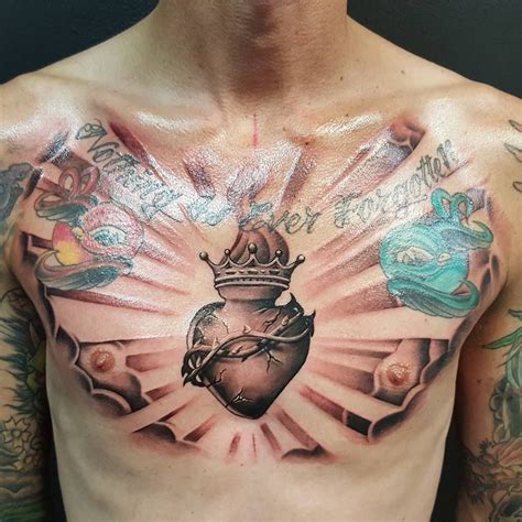 heart chest tattoo | Sacred heart tattoos, Heart tattoo, Heart tattoo ...