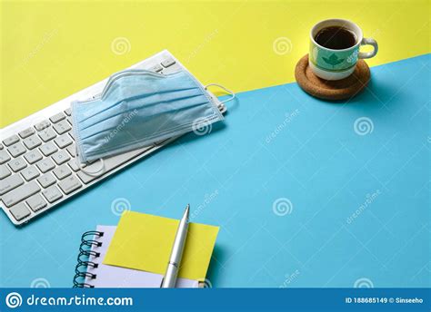 Yellow and Blue Table Top with Coffee, Keyboard and Face Mask Editorial Stock Image - Image of ...