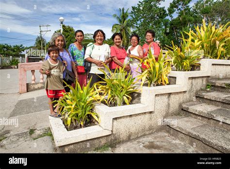 Portrait of Catholic Christian Filipino women who sell votive candles ...