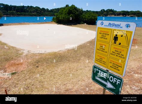 Golf course warning sign "danger from flying golf balls" on Brioni islands, Veliki Brijun ...