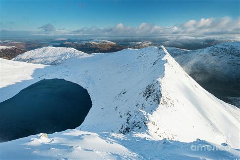 Winter view of Striding Edge and Red Tarn from Helvellyn, Lake District, UK Photograph by Justin ...