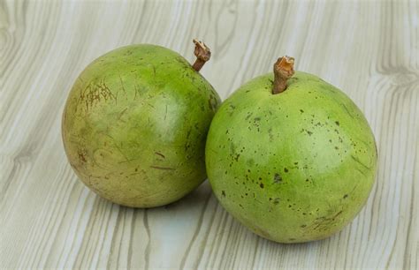 Sapote on wood 12731571 Stock Photo at Vecteezy