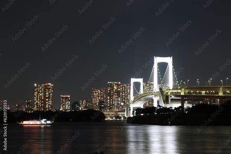 Night view of Odaiba Seaside Park and Rainbow Bridge in Tokyo, Japan ...