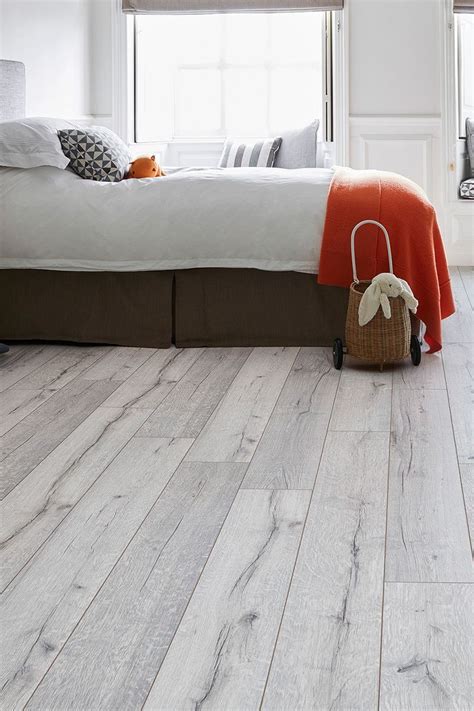 A Scandinavian-style white wood-effect floor that offers fantastic value, Series… | White ...