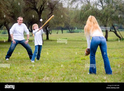 Family playing baseball Stock Photo - Alamy