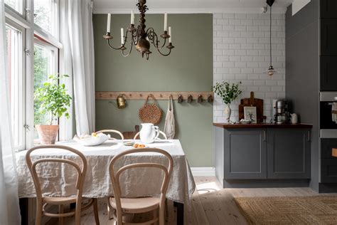 Grey kitchen cabinets against sage green walls in an attic apartment - COCO LAPINE DESIGNCOCO ...