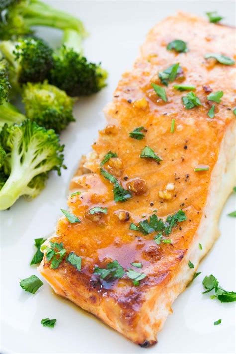 The best easy oven baked salmon recipe! The salmon is cooked in a honey garlic sauce that is so ...