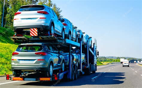 Premium Photo | Cars carrier truck in road or highway of Poland. Lorry transporter at logistics ...