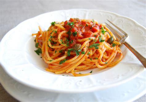 Naples Spaghetti alla Puttanesca (Campania, Italy) - traditional food Naples - traditional ...