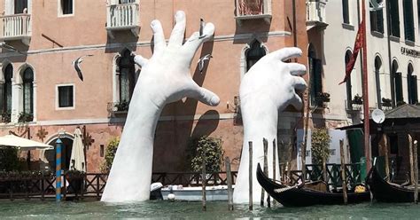 Contemporary Sculpture by Lorenzo Quinn Emerges from Venice's Lagoon