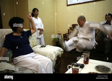Chinese Tai Chi master Yan Fang (L) demonstrates Pushing Hands, a ...
