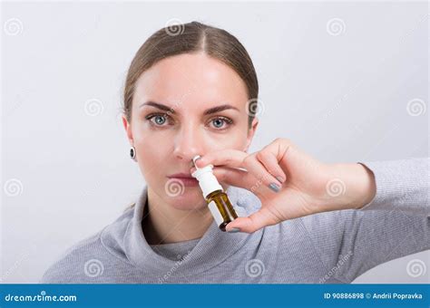 Attractive Girl Taking a Medicine with Spray Inside the Nose on Light Background Stock Photo ...