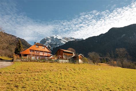 French Alps Chalet Snow Capped Mountains Photograph by Pius Lee