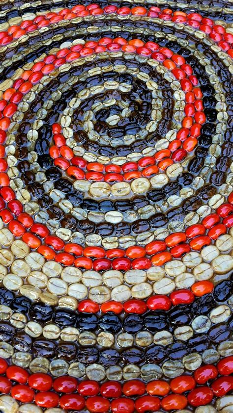 Spiral mosaic handmade with coffee beans, Huayruro seeds, grains, drift seeds and resin by ...