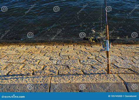 Fishing in the Tagus River at Sunset in Lisbon Stock Photo - Image of ...