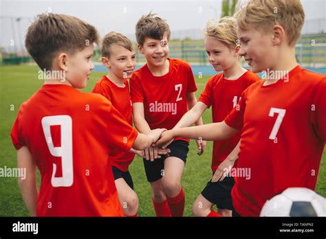 Happy boys play team sport. Kids smiling in school sports team. Junior ...