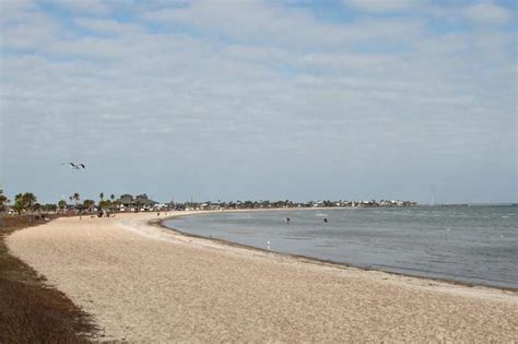 The crescent-shaped public beach in Rockport. Photo-5991663.81532 - San Antonio Express-News