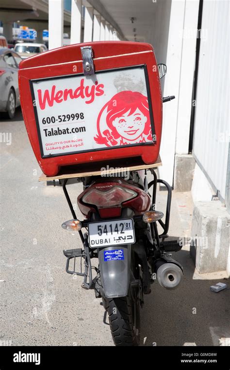 Wendy's fast food restaurant delivery scooter parked outside Wendy's in Dubai UAE Stock Photo ...