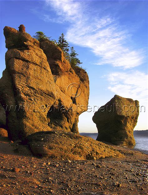 CANADA;NEW BRUNSWICK;HOPEWELL ROCKS;ROCKS; WATER;VERTICAL;