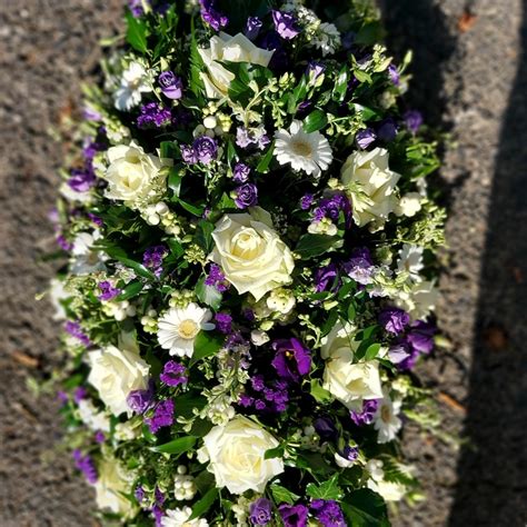 Casket spray purple and white | Flowerzone