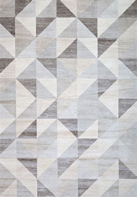 an area rug with many different shapes and sizes on it's surface, including triangles