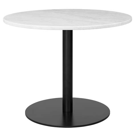 10 Dining Table is driven by the theme of lightness The slender central column base makes a ...