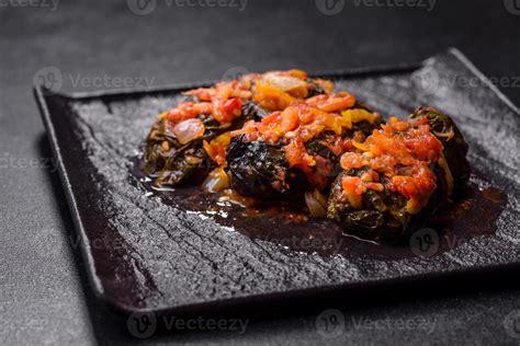 Dolma, stuffed grape leaves with rice and meat on a dark background 11109872 Stock Photo at Vecteezy