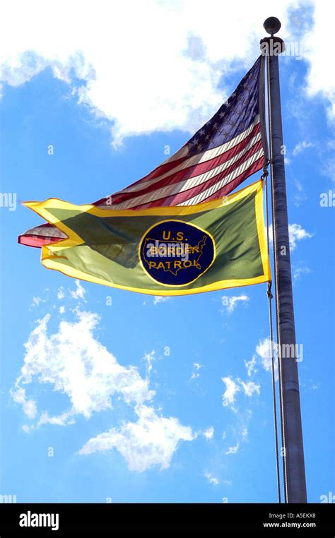 USA, US Border Patrol flags flying in front of Blue Sky, clouds. Marysville, Michigan USA Stock ...