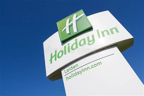 Holiday Inn Hotel Sign Against Blue Sky. Editorial Stock Photo - Image ...