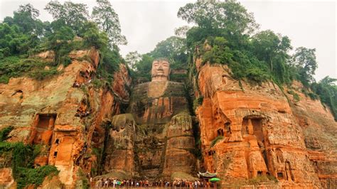 China flooding: Waters reach the toes of famous Leshan giant Buddha statue | CNN